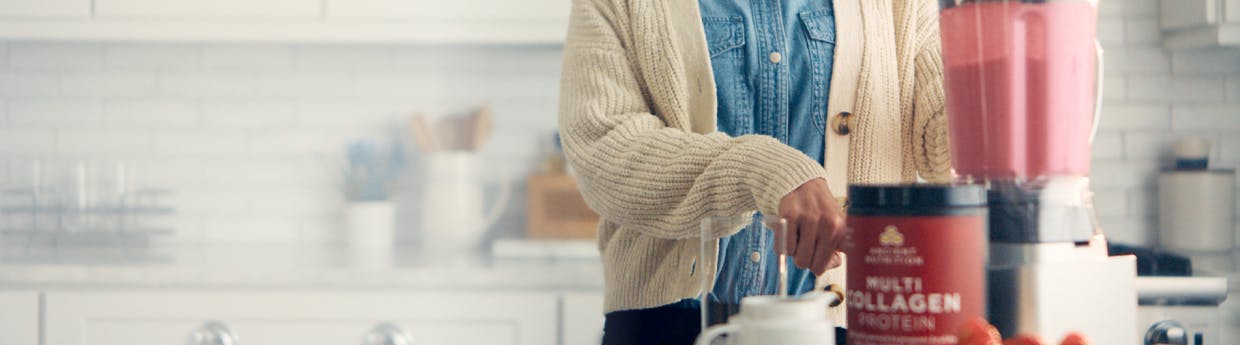 woman making smoothie with multi collagen protein