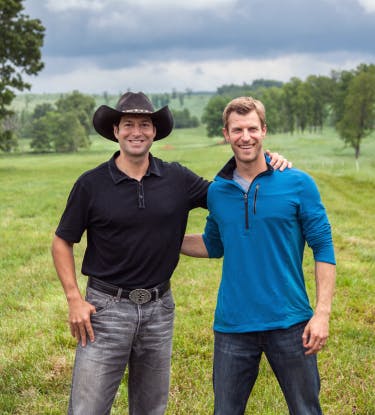 Jordan Rubin and Dr. Josh Axe on a farm